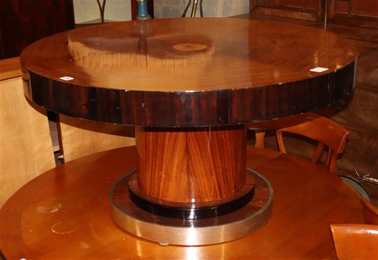 A 1930s mahogany and ebonised circular topped coffee table, with chrome bordered plinth, diameter 98cm